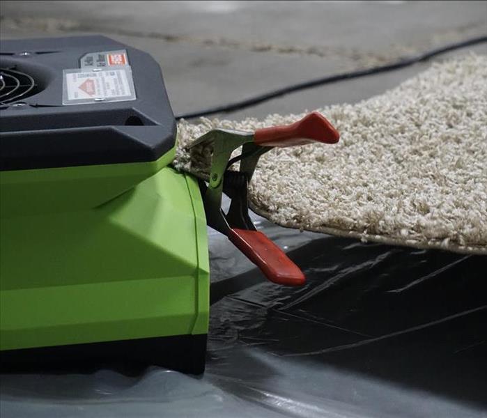 Carpet Hooked to the air mover to control air movement underneath the carpet
